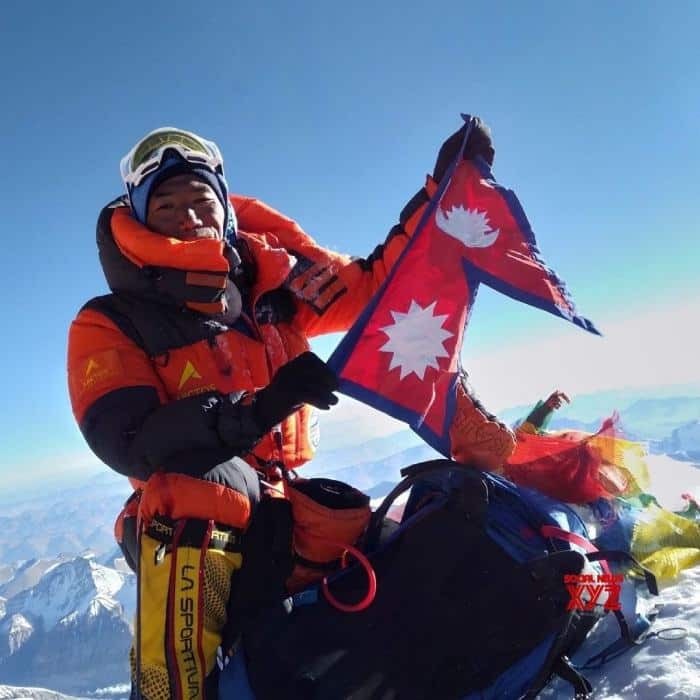 Kami rita sherap holding national flag