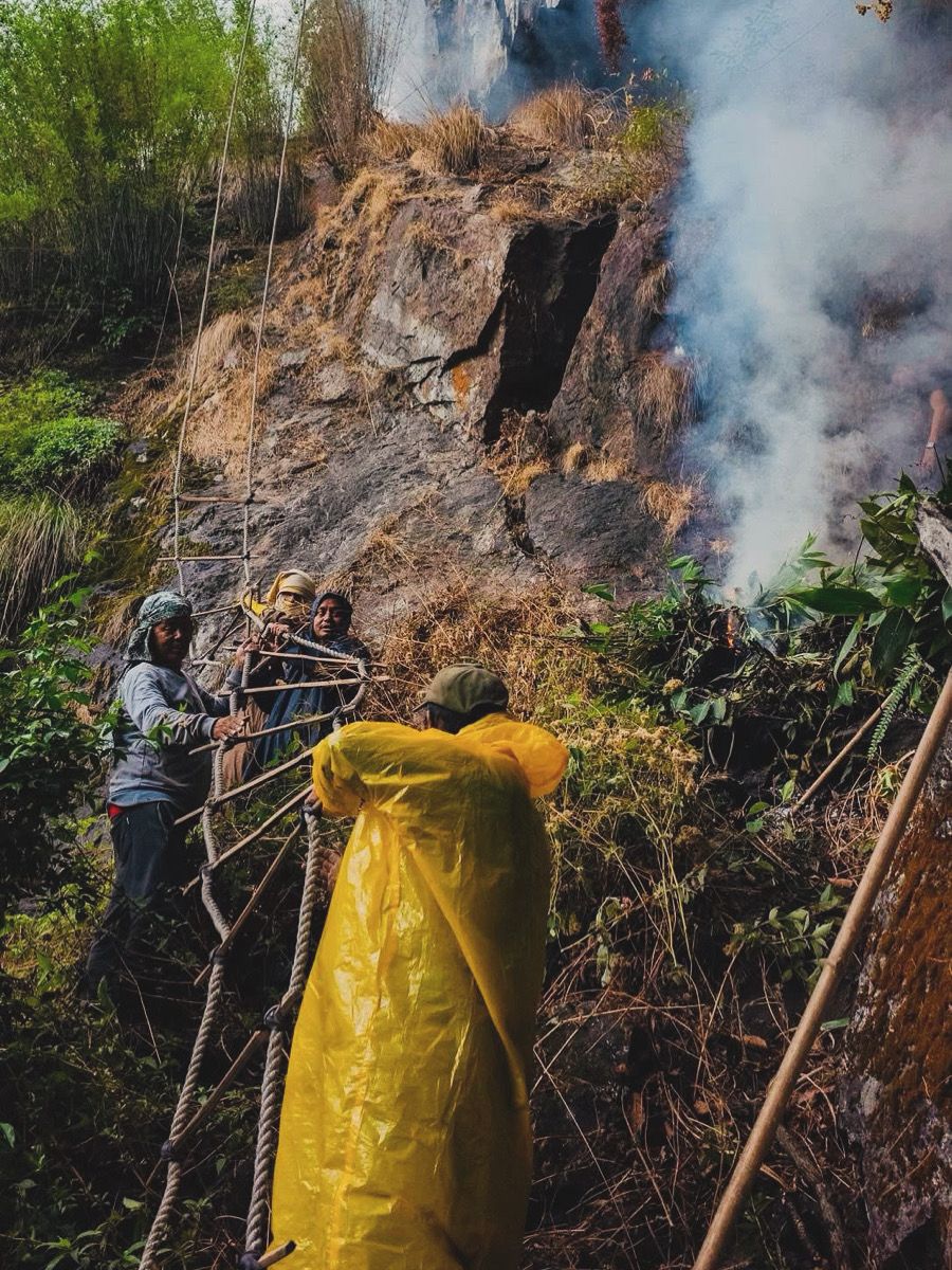Rope ladder setup by villagers for mad honey Harvesting