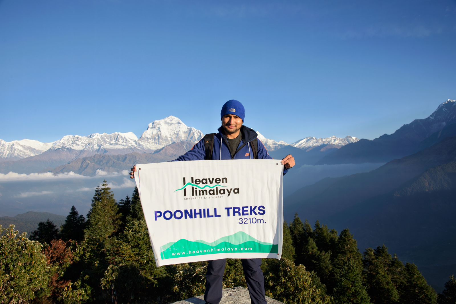 Trekker capturing memories at Poonhill